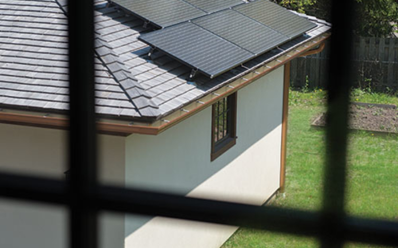 Solar panels on roof of residential garage.