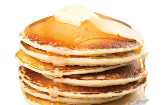 Stack of pancakes with maple syrup