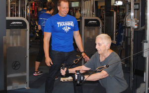 Philip Stotter, owner of Club Fit, working with a client