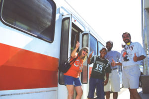 Passengers excited to board the Rapid to ride to sports event