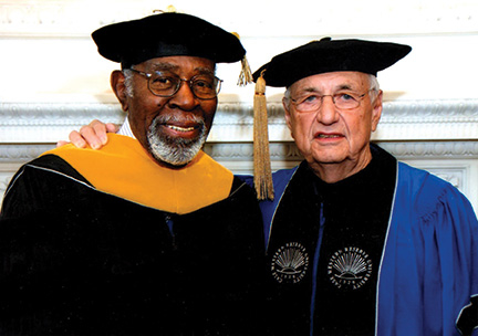Madison poses with the architect Frank Gehry at the 2013 Case Western Reserve University commencement.