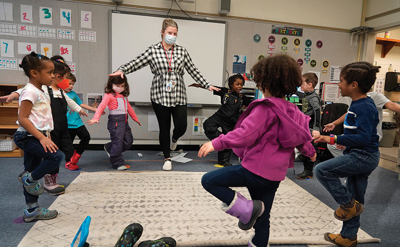 Preschool students and teacher in a circle