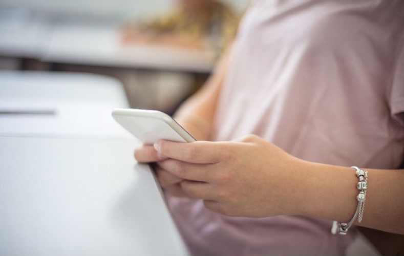 Student on cell phone in class