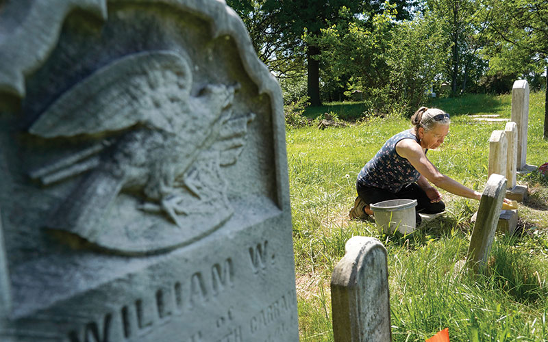 Restoration expert at work at Warrensville West Cemetery