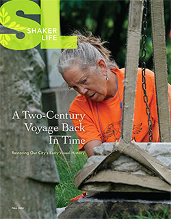 Cover of the fall 2024 issue of Shaker Life featuring a woman restoring an old gravestone
