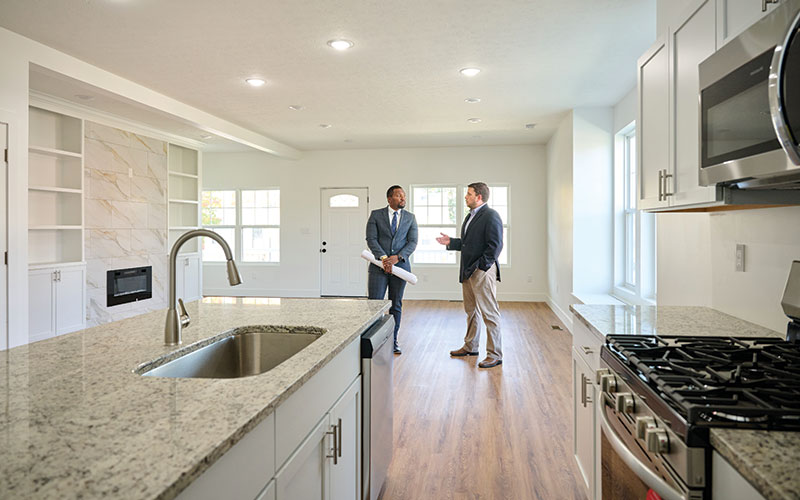 Ishmael Martin and Kyle Krewson in the kitchen of a newly completed infill home