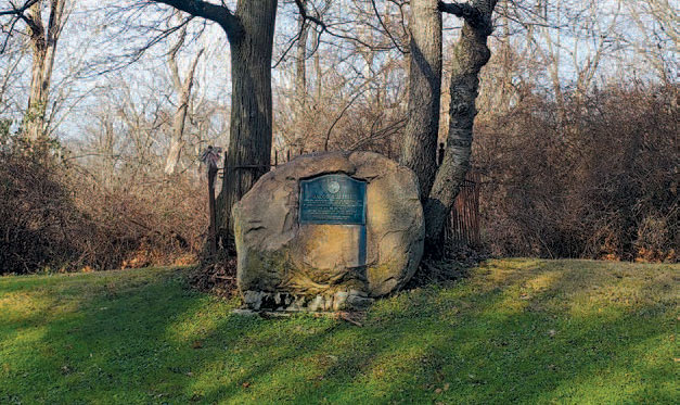 Boulder on South Park Blvd. marking grave site of Civil War soldier and early settler