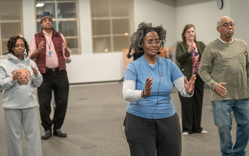 Pamela Corbin leading a tai chi class at Shaker Library