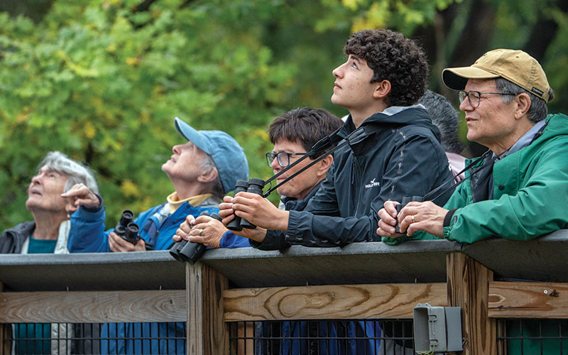 Bird watchers on the All People's Trail at the Nature Center