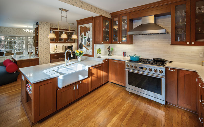 The kitchen footprint was widened to allow for a wheelchair to move 360-degrees without obstruction. Also, a new lower peninsula makes it easier for sink access on one side and on the opposite side, the lack of lower cupboards frees up room for a wheelchair to roll under.