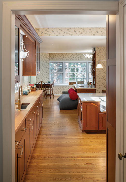 Nestled just off the primary bedroom, the new laundry space is behind doors on the second floor landing.