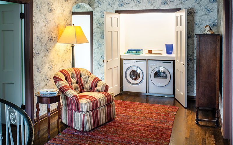 Nestled just off the primary bedroom, the new laundry space is behind doors on the second floor landing.