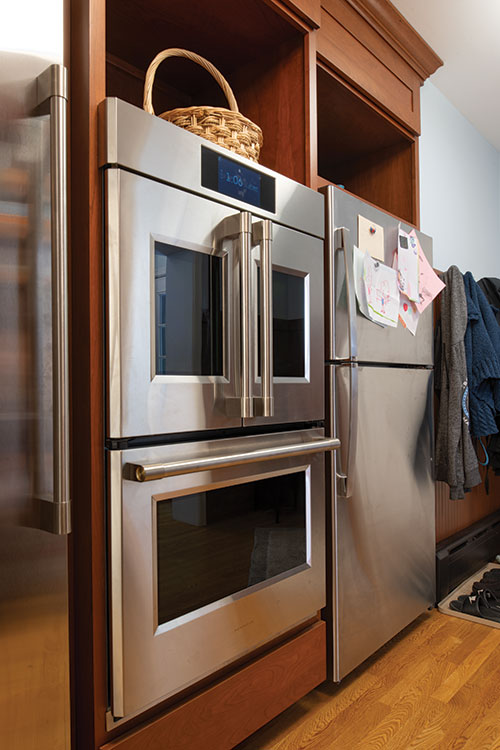 Nestled just off the primary bedroom, the new laundry space is behind doors on the second floor landing.