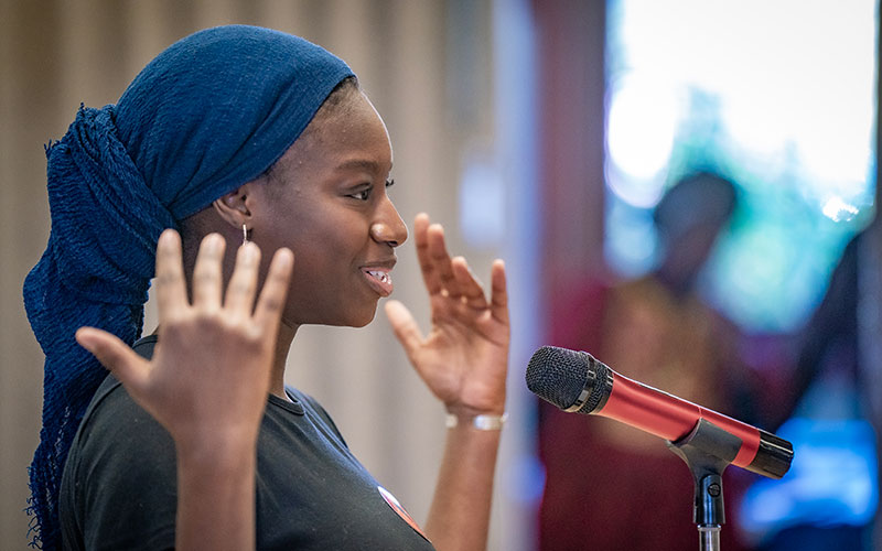 Oumou Kaba performs a poem she wrote called “In Between