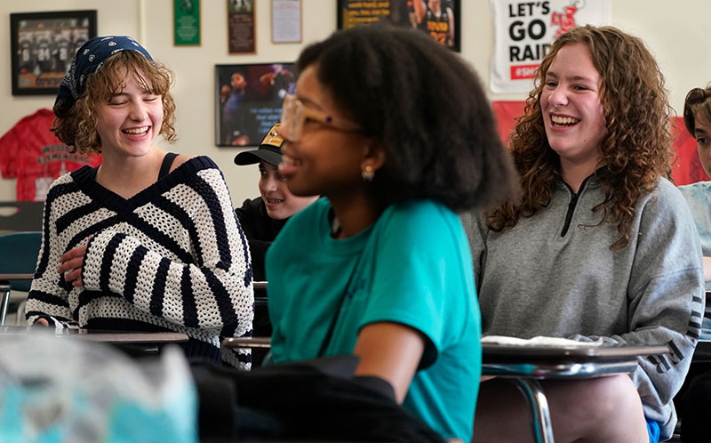 Students in a classroom laughing