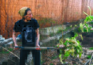 Rust Belt Riders employee shoveling compost